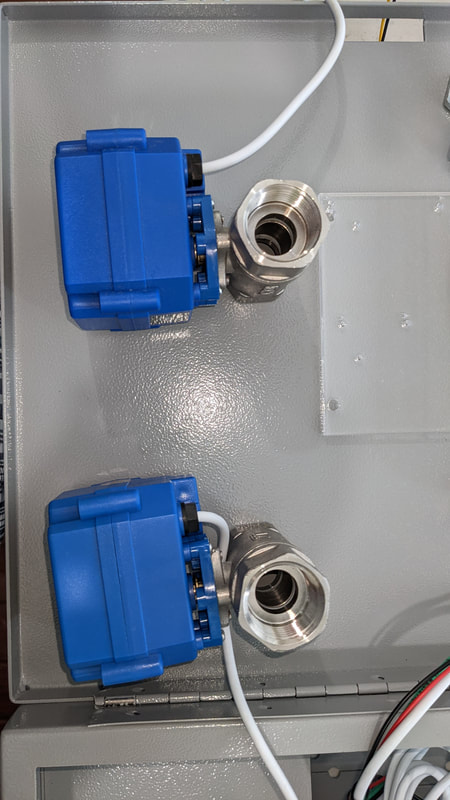 Two water valves installed in controller enclosure